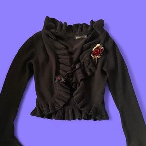 Black Ruffled Sweater with Floral Accent